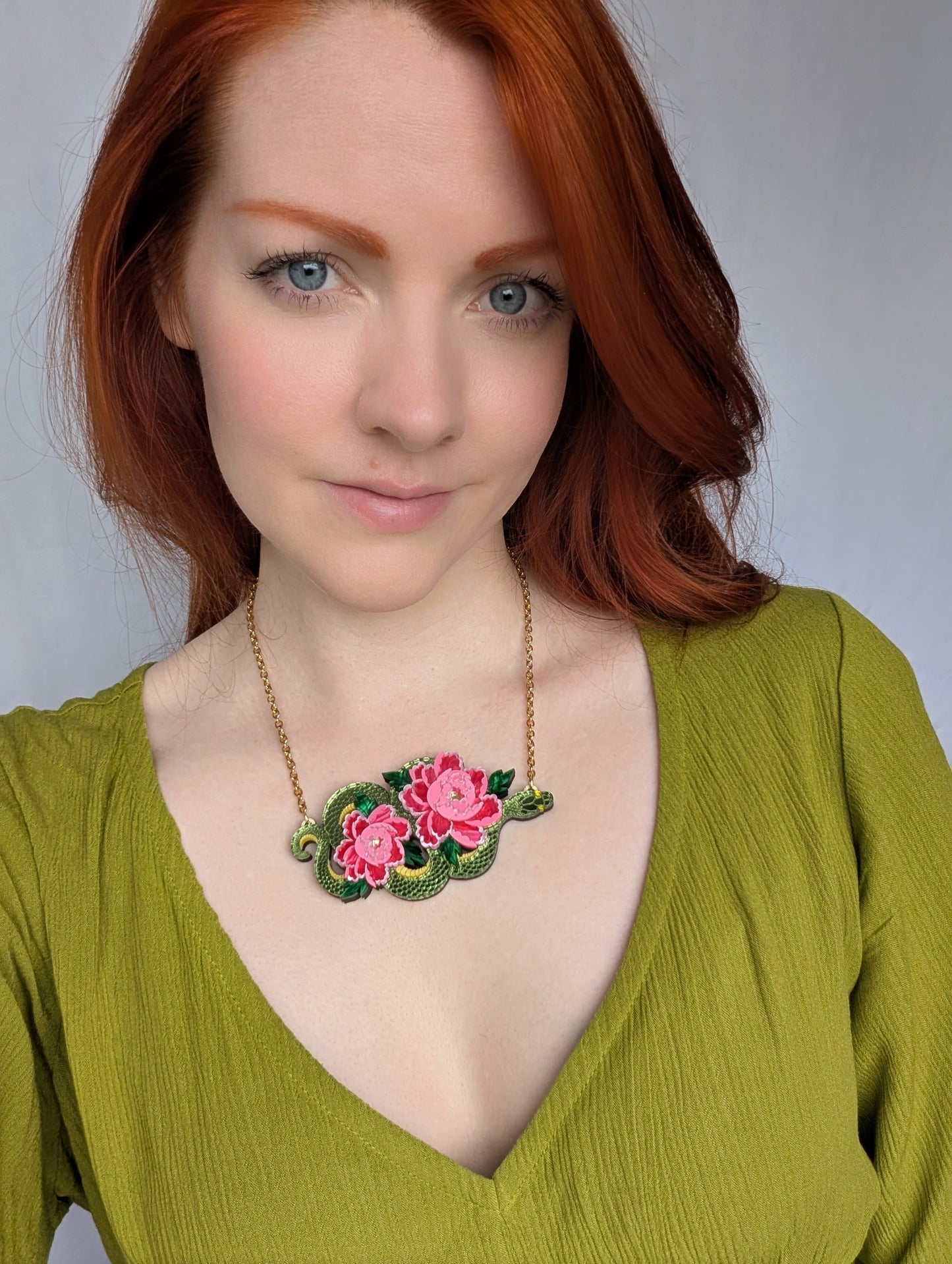 Acrylic green snake necklace with pink peony flowers 
