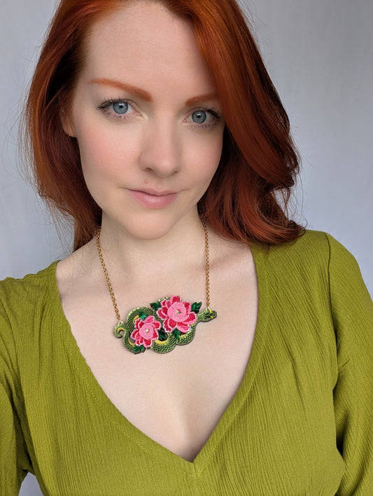 Acrylic green snake necklace with pink peony flowers 