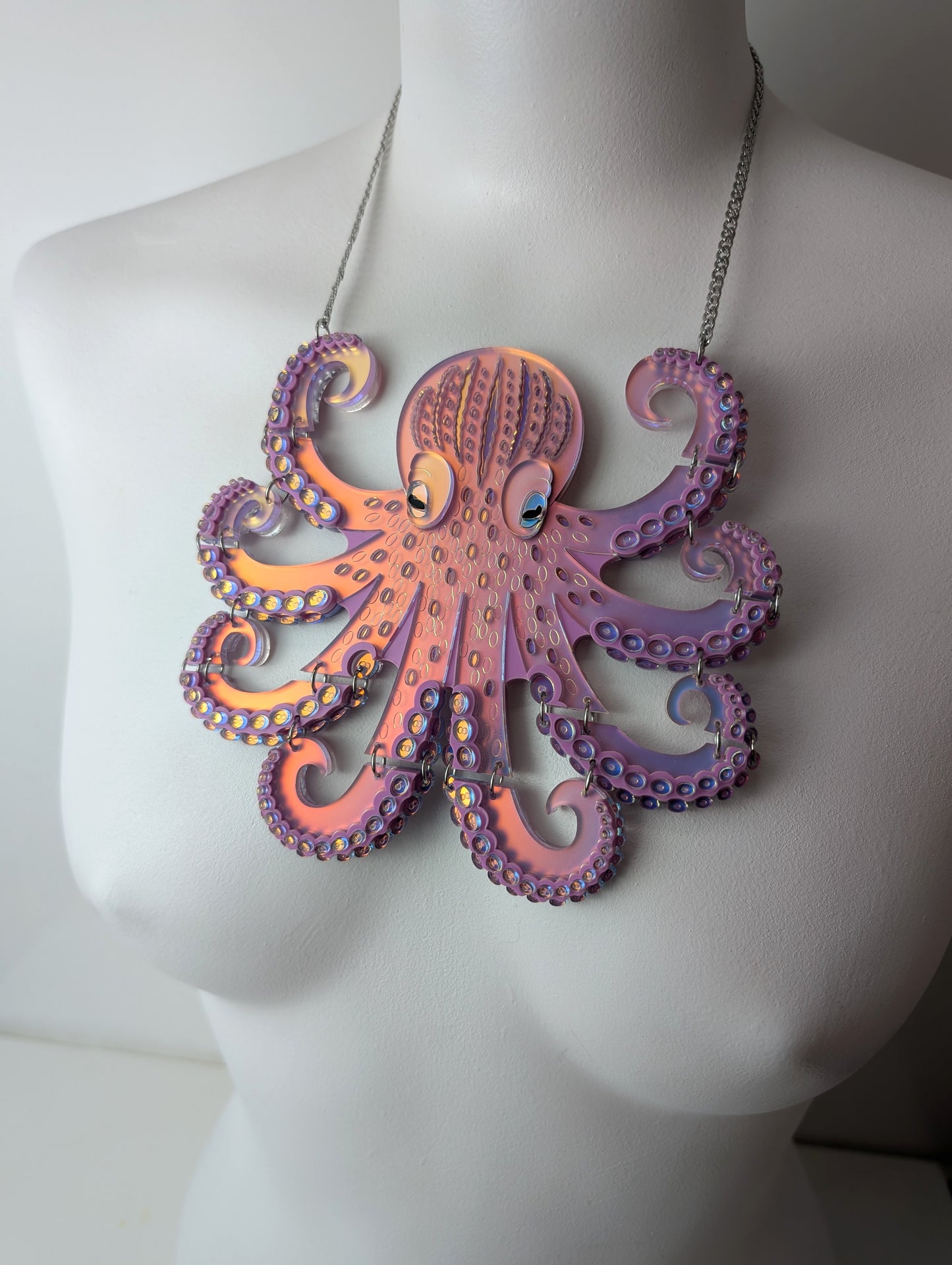 Handmade laser cut articulated acrylic iridescent octopus necklace by rock the panda