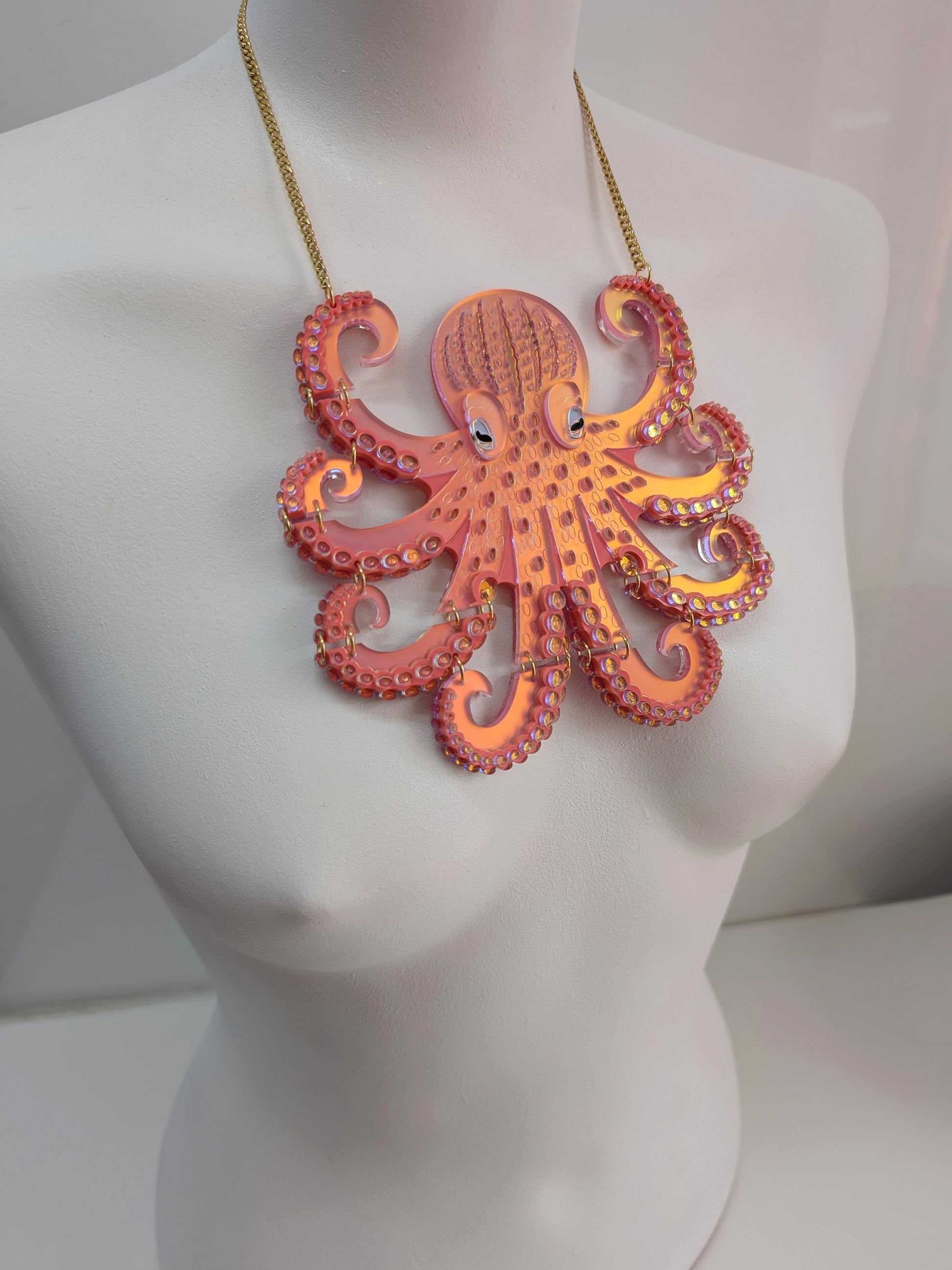 Laser cut handmade acrylic octopus statement necklace in iridescent coral. Acrylic jewellery jewelry 