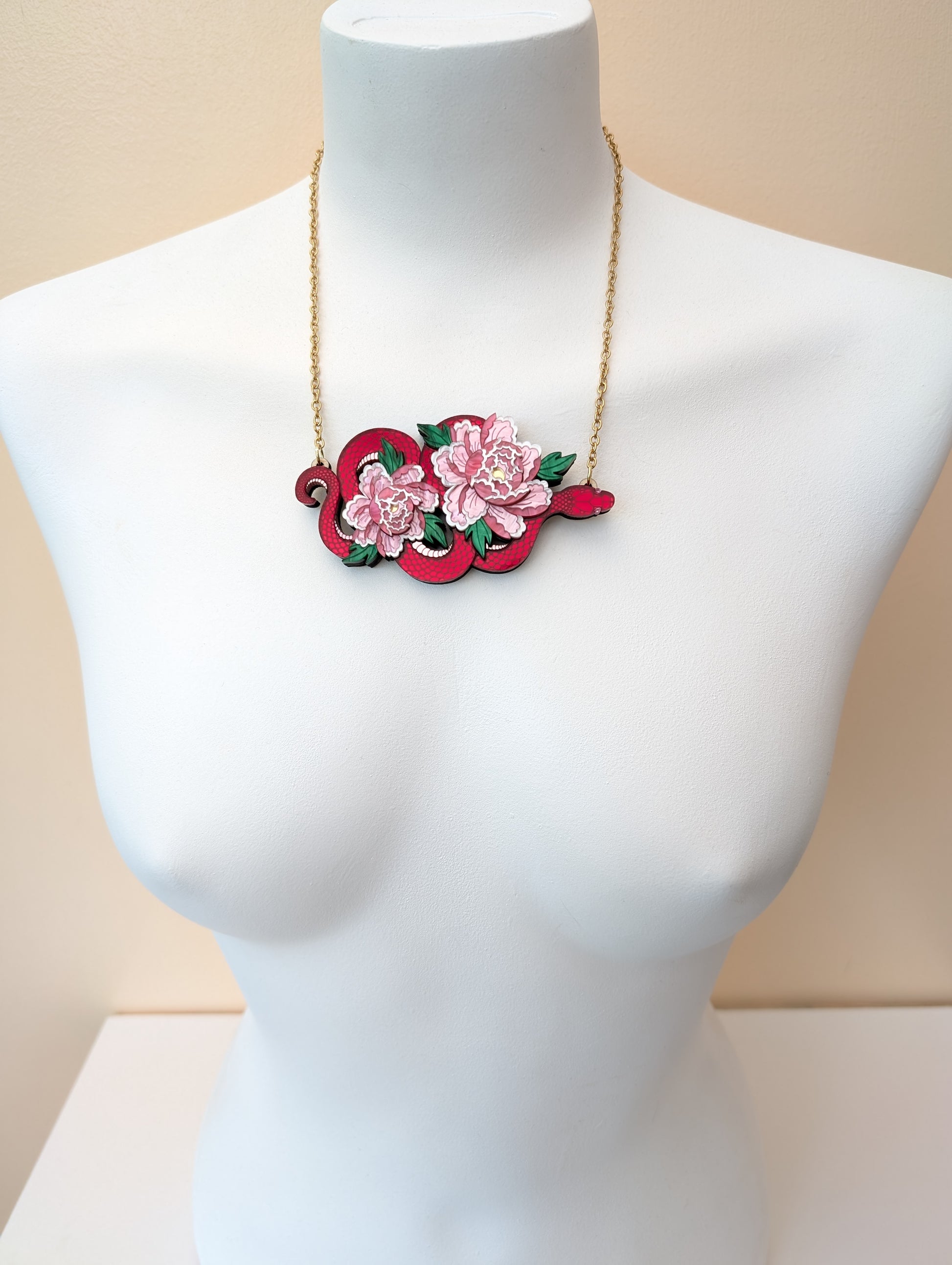 Handmade laser cut acrylic red snake necklace with pink peony florals