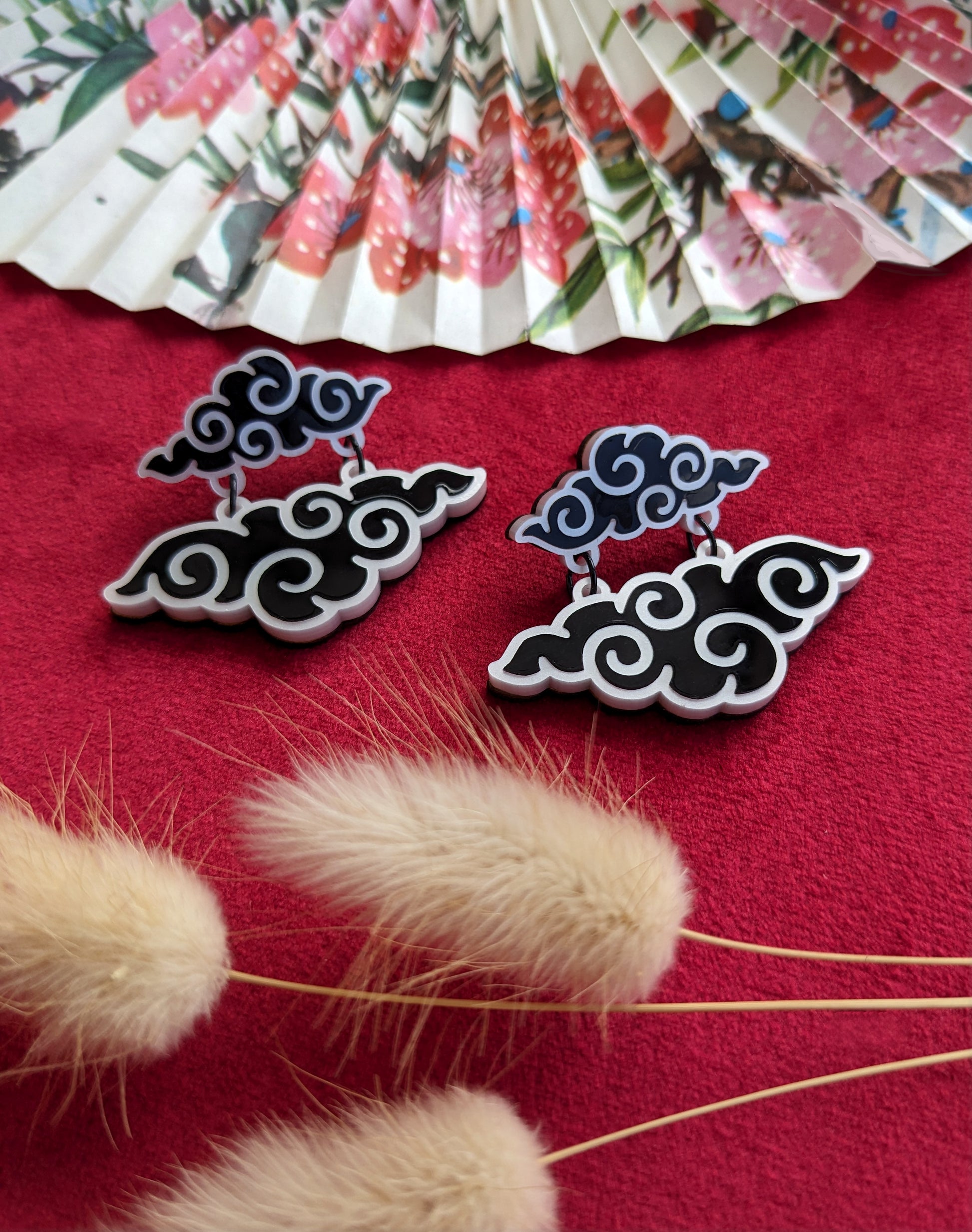 A pair of black and white acrylic cloud earrings 