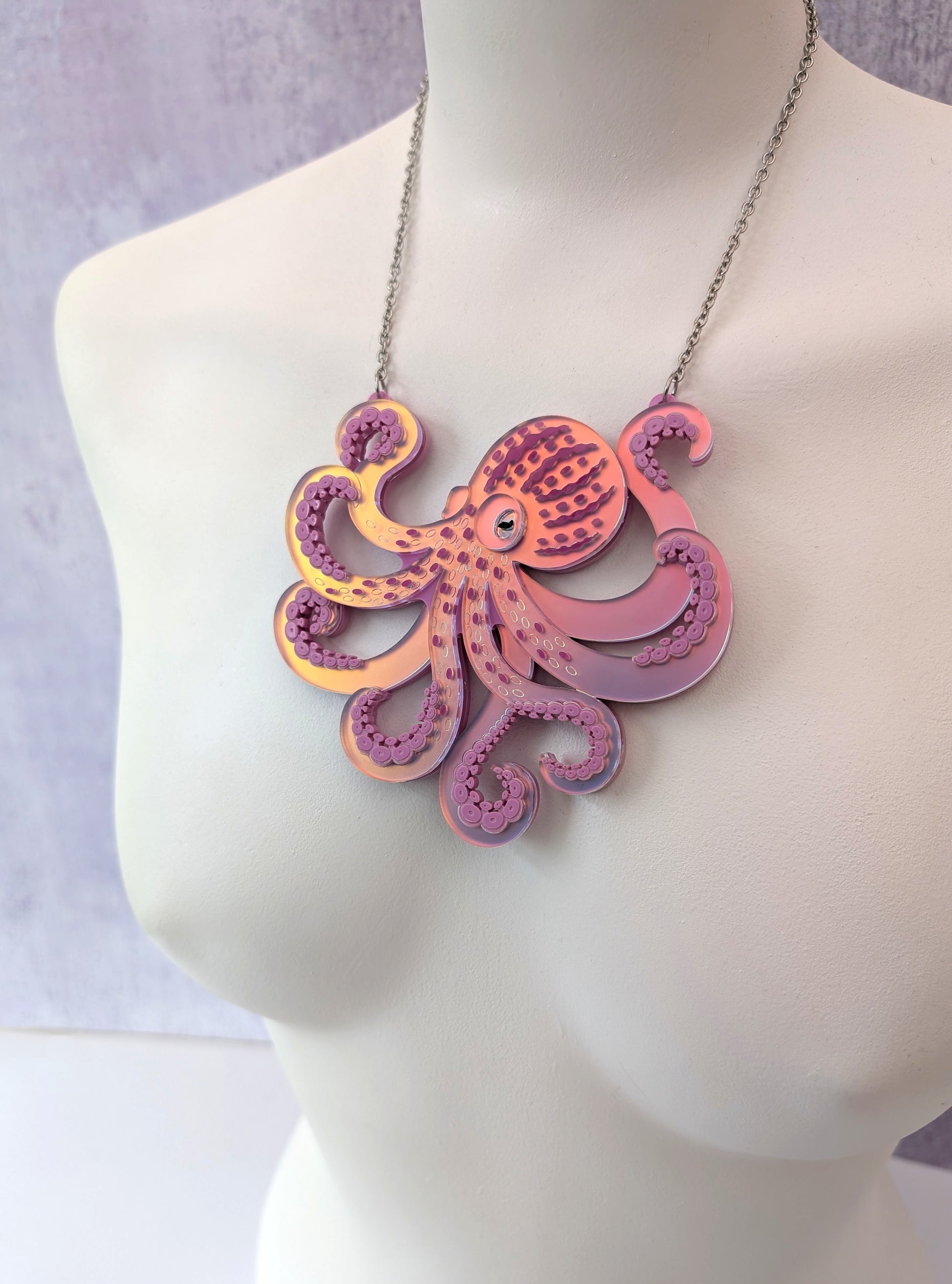 Laser cut handmade acrylic octopus necklace in iridescent lilac